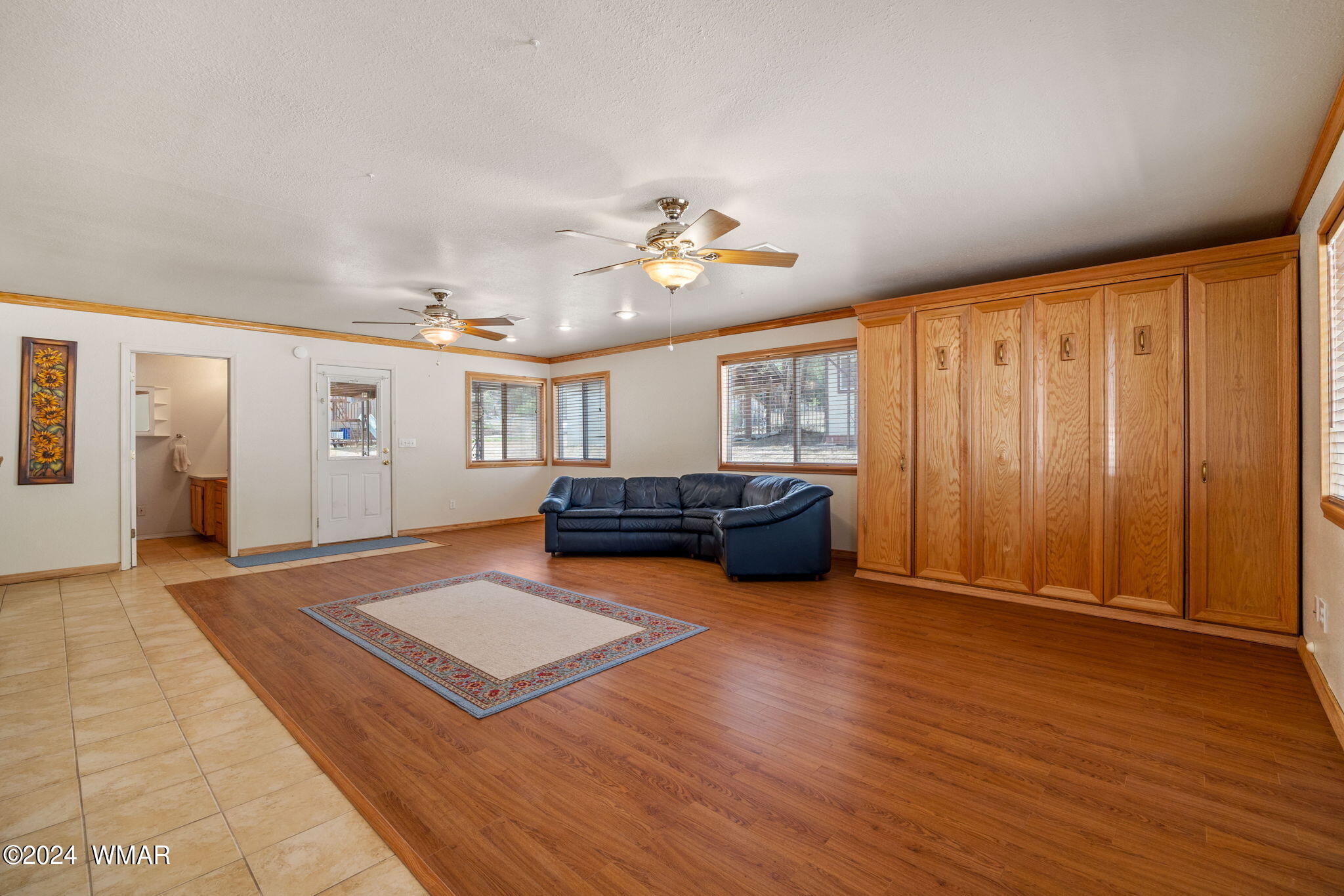 3368 Buckskin Canyon Road Heber, AZ 85928 - Photo 18 of 48 a living room with furniture a window and bookshelf