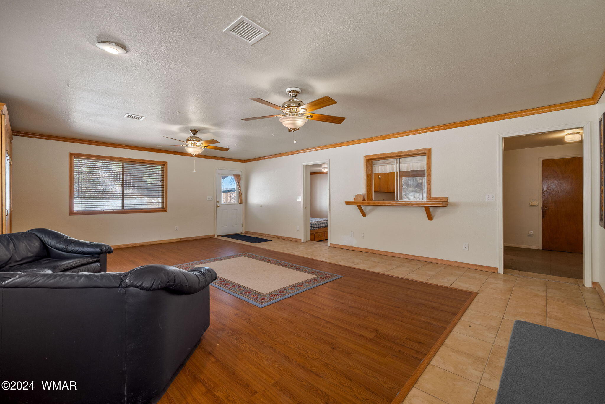 3368 Buckskin Canyon Road Heber, AZ 85928 - Photo 19 of 48 a living room with furniture and a ceiling fan