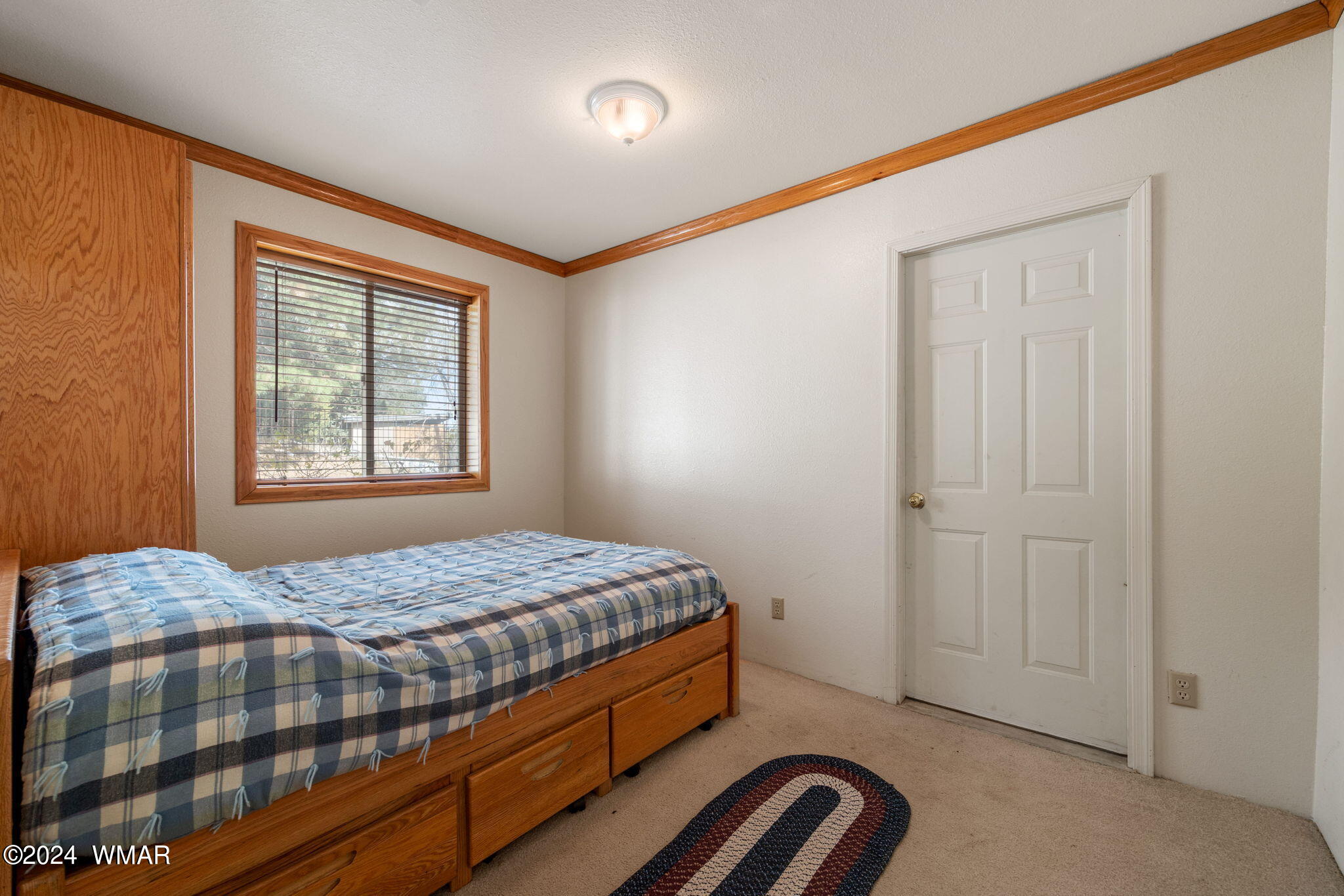 3368 Buckskin Canyon Road Heber, AZ 85928 - Photo 22 of 48 a bedroom with a bed and a window