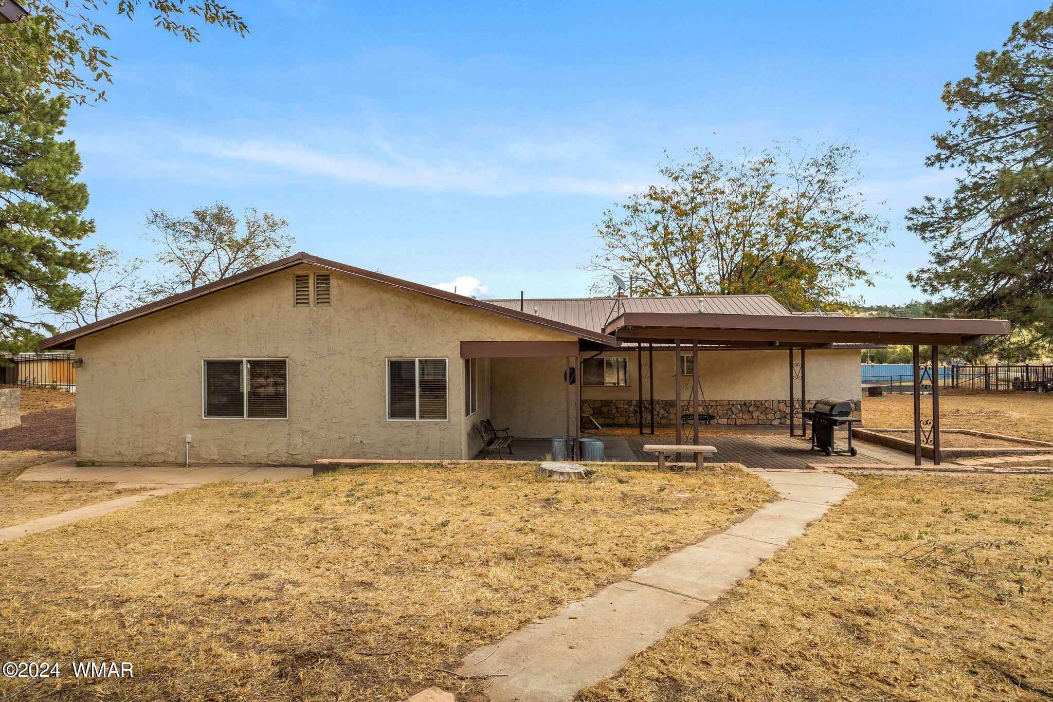 3368 Buckskin Canyon Road Heber, AZ 85928 - Photo 27 of 48 a house with trees in the background