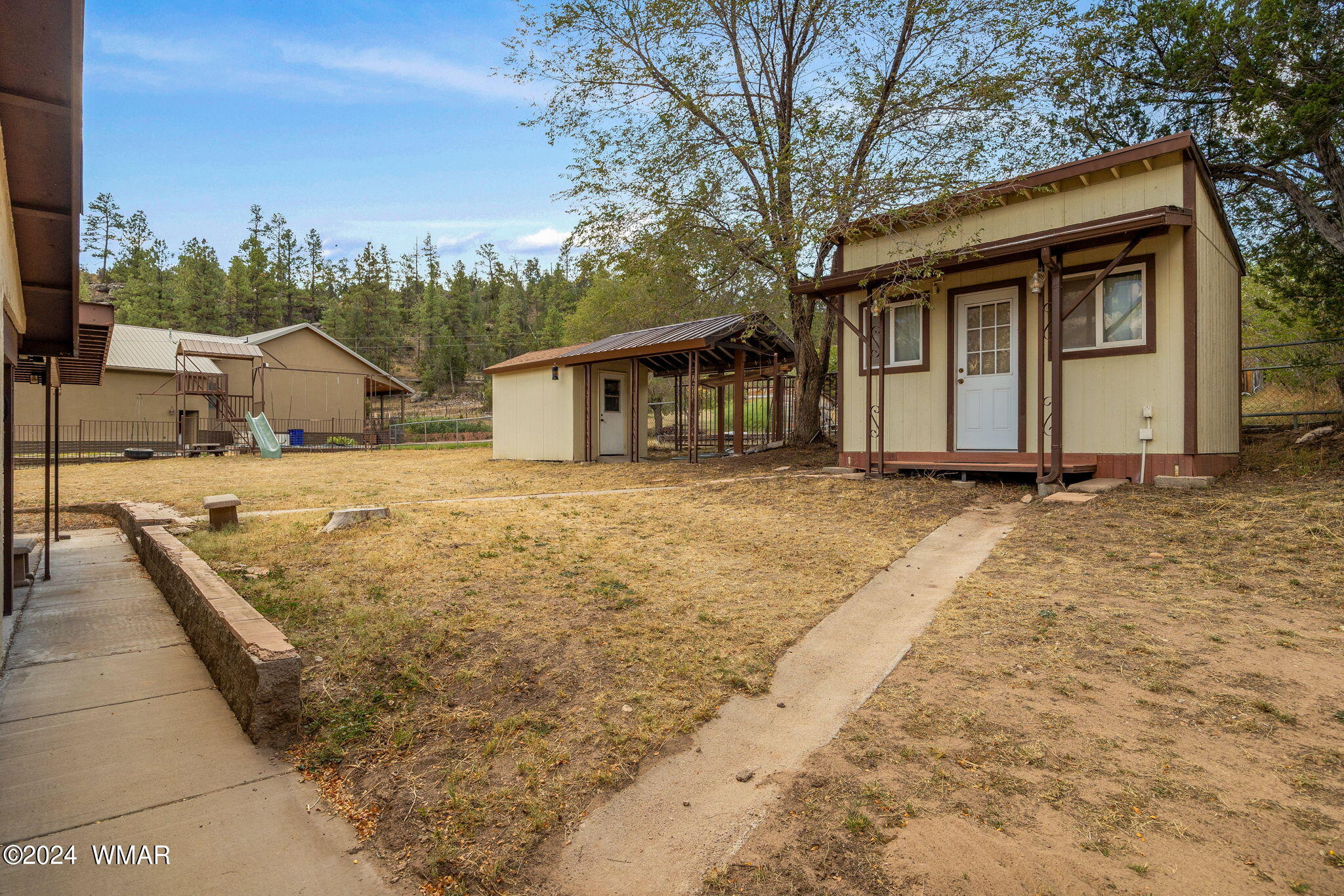 3368 Buckskin Canyon Road Heber, AZ 85928 - Photo 28 of 48 a view of a house with a yard