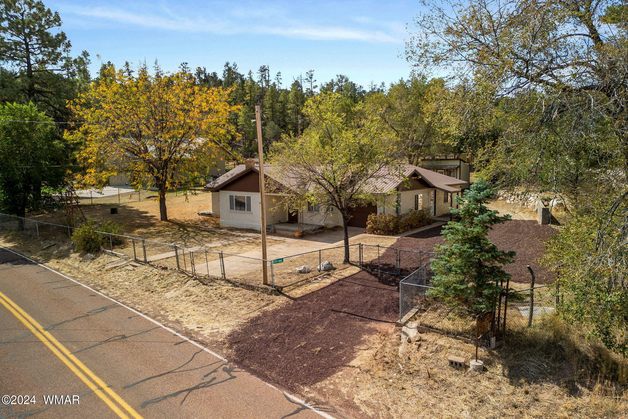 3368 Buckskin Canyon Road Heber, AZ 85928 - Photo 32 of 48 a view of a house with a yard