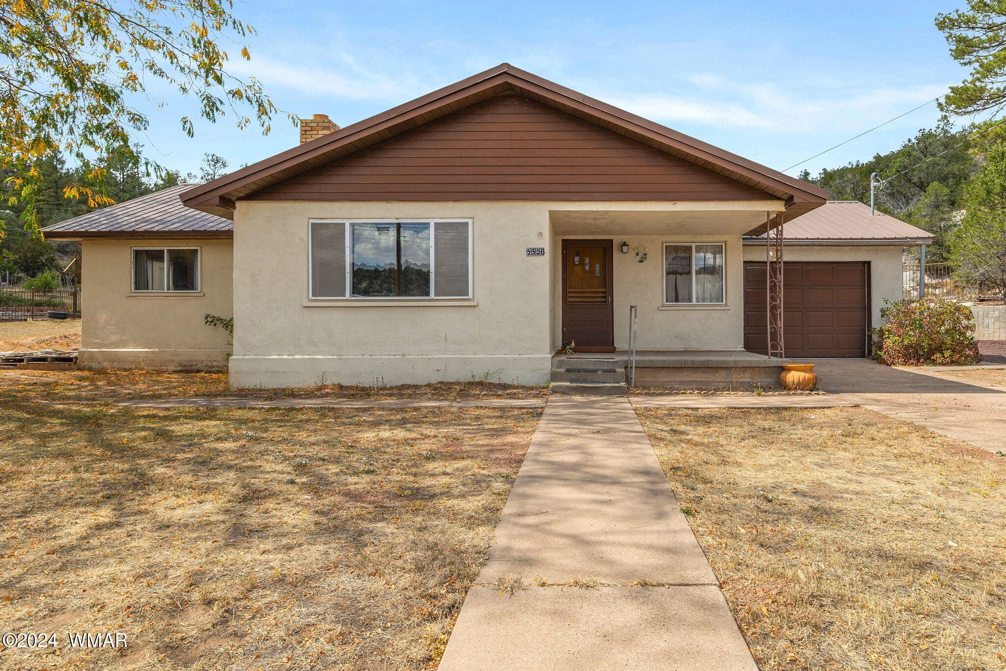 3368 Buckskin Canyon Road Heber, AZ 85928 - Photo 38 of 48 a front view of a house with a yard