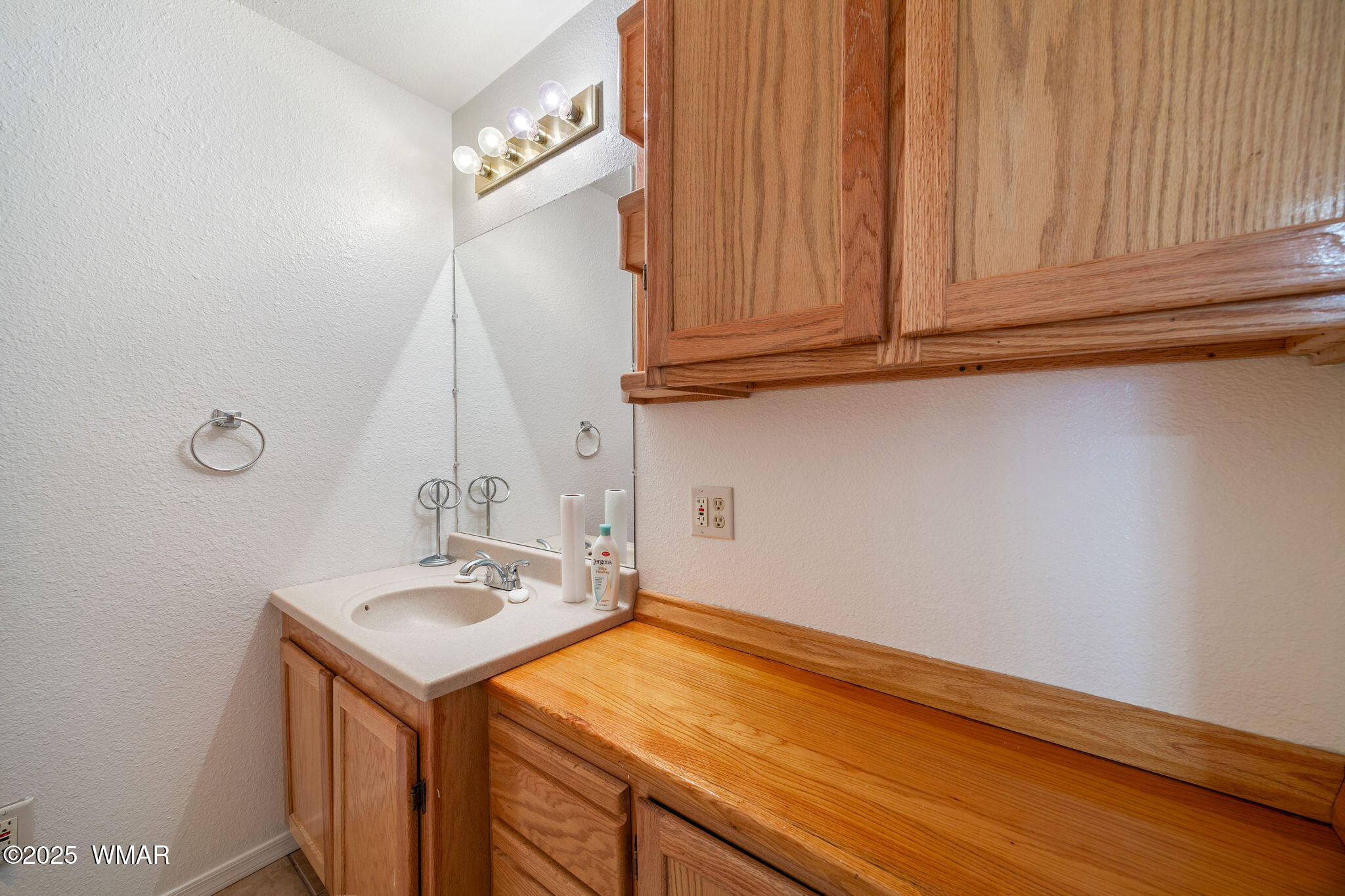 3368 Buckskin Canyon Road Heber, AZ 85928 - Photo 43 of 48 a bathroom with a sink and a mirror