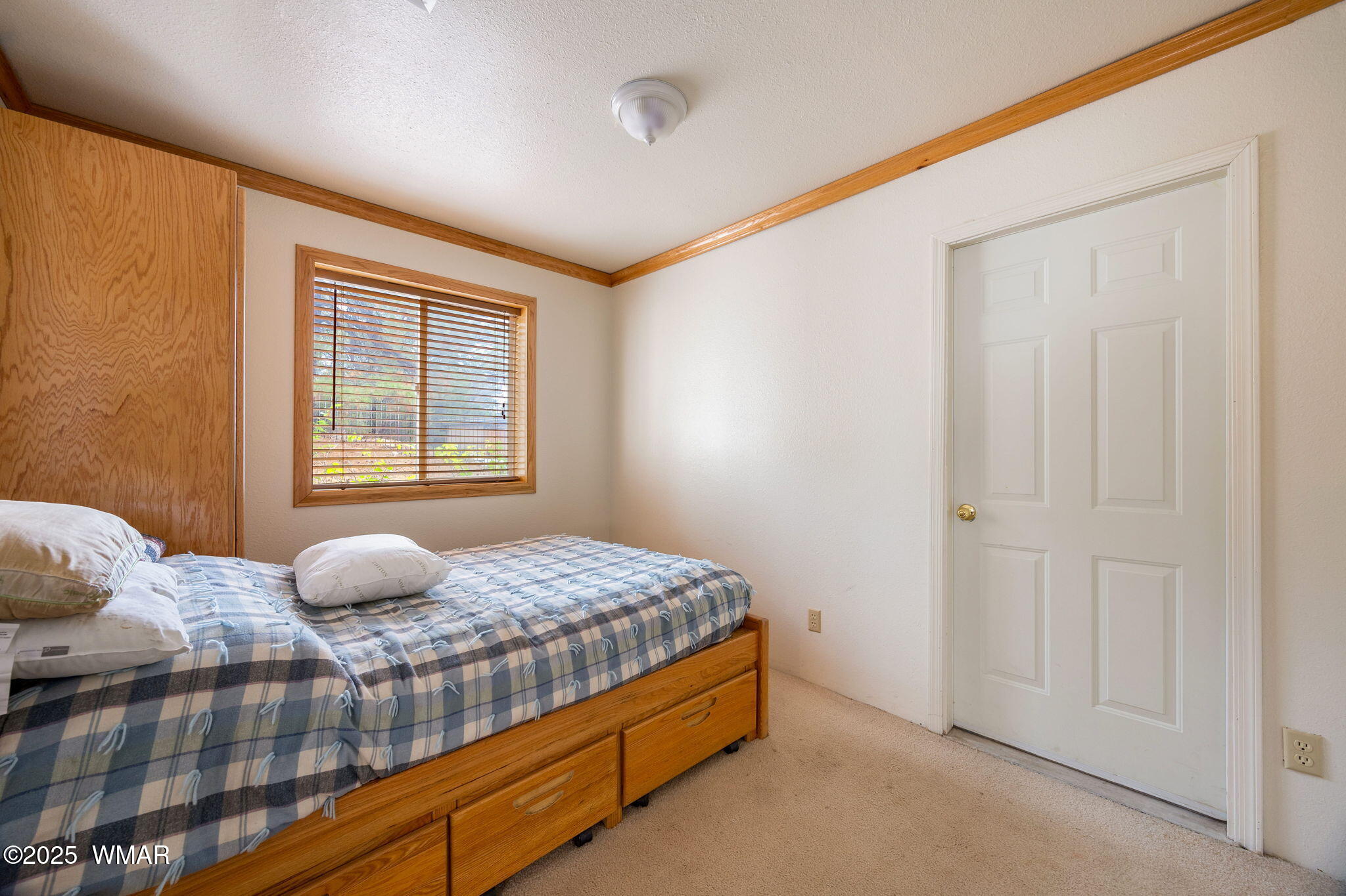 3368 Buckskin Canyon Road Heber, AZ 85928 - Photo 45 of 48 a bedroom with a bed and window