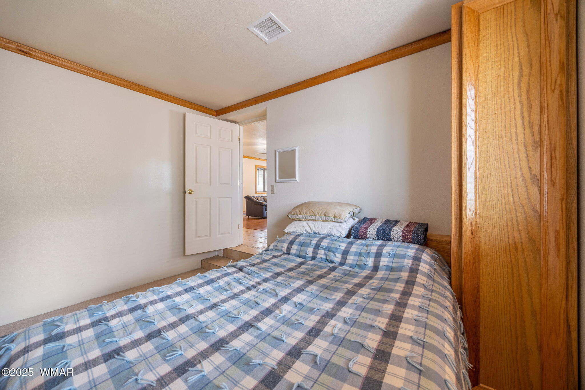 3368 Buckskin Canyon Road Heber, AZ 85928 - Photo 46 of 48 a bedroom with a bed and a mirror