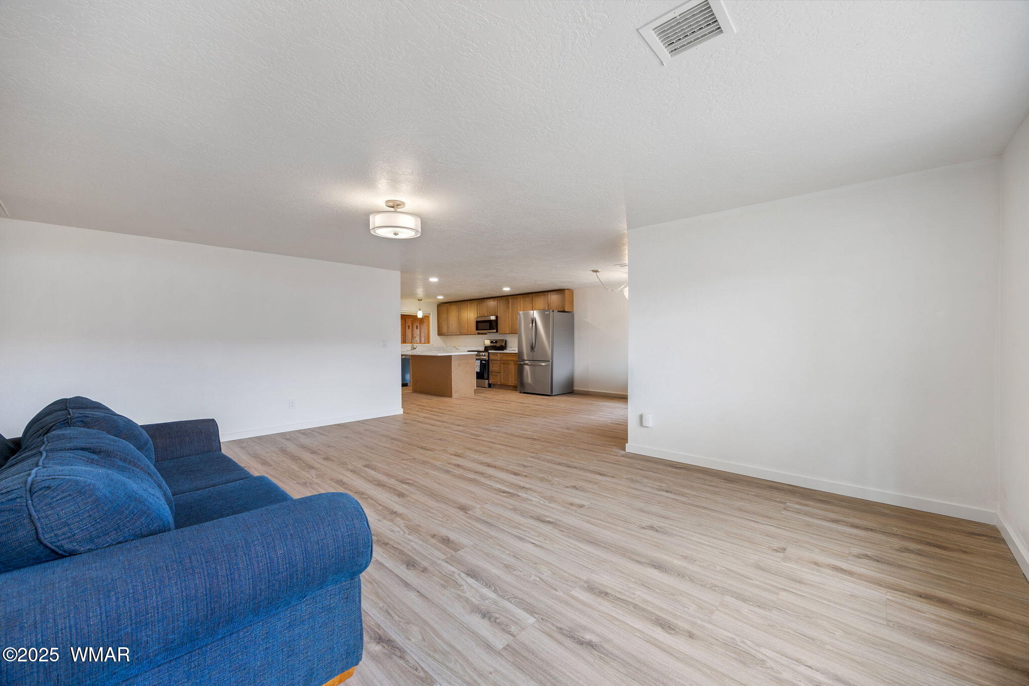 3368 Buckskin Canyon Road Heber, AZ 85928 - Photo 6 of 48 a living room with furniture and a wooden floor