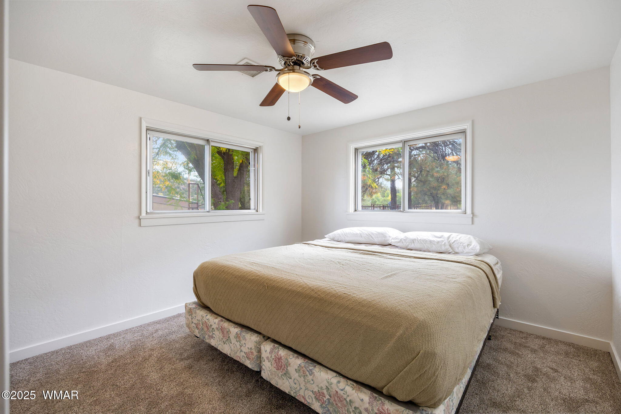 3368 Buckskin Canyon Road Heber, AZ 85928 - Photo 7 of 48 a bedroom with a bed and window
