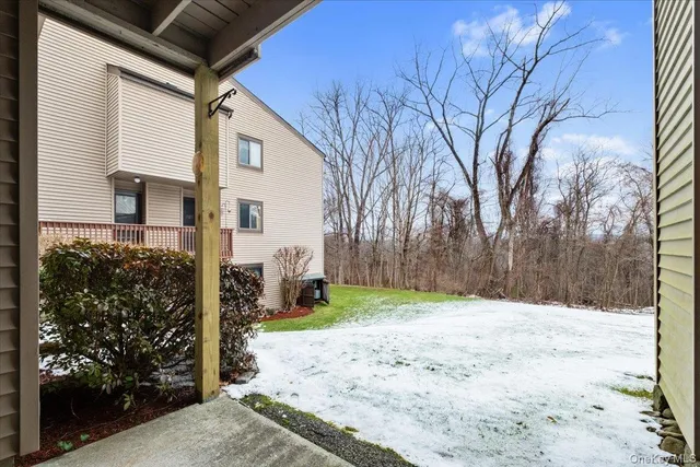 a view of a backyard of the house