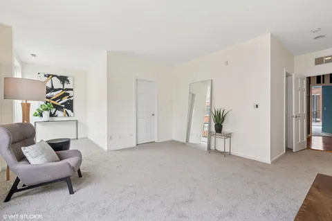 a view of livingroom with furniture and closet
