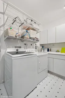 a kitchen with cabinets a sink and appliances