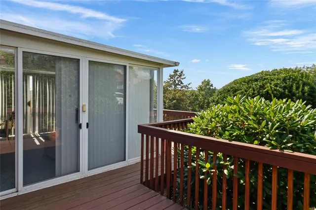 a view of a balcony with wooden floor