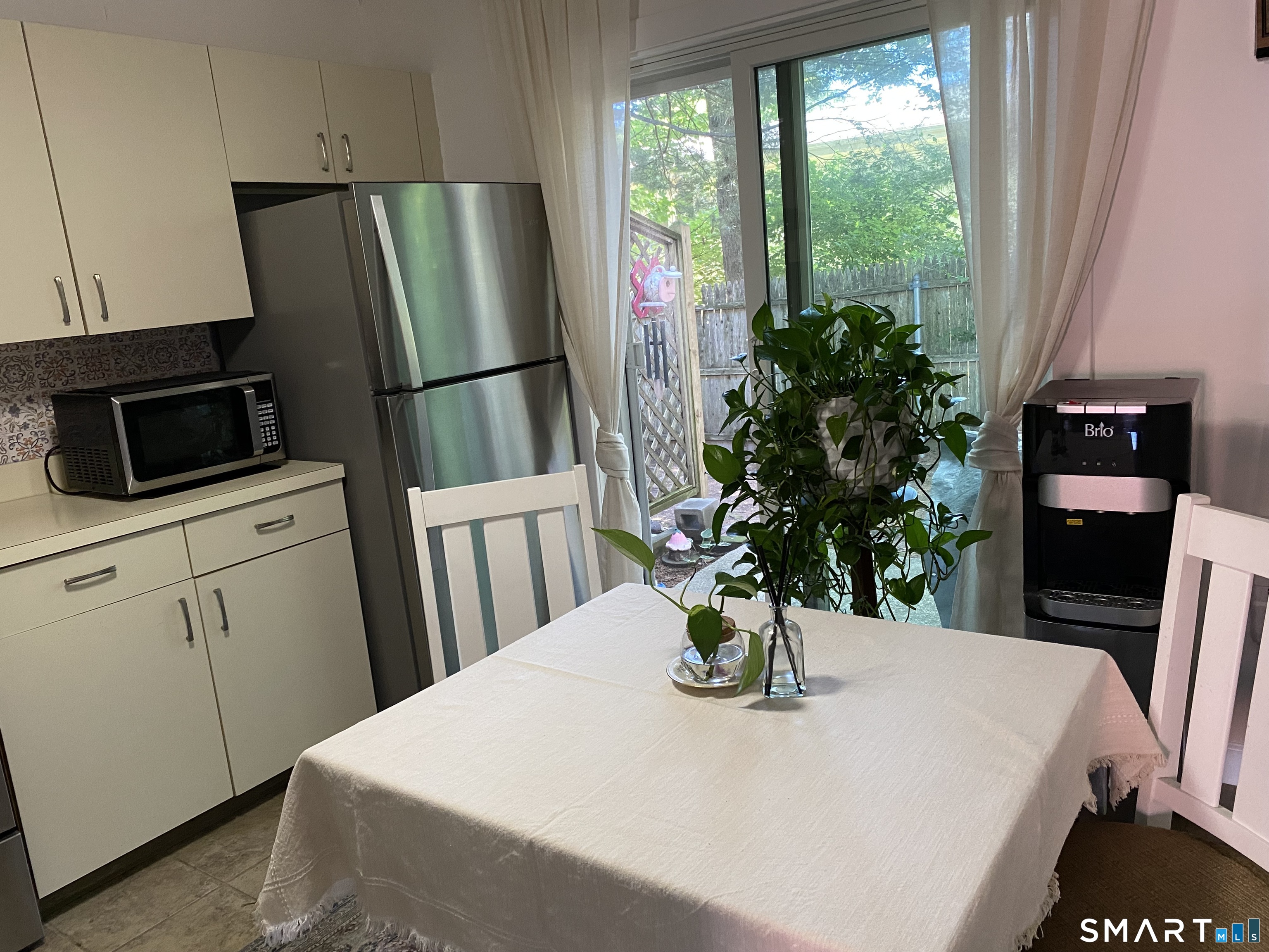 585 Park Road, Unit 58 Waterbury, CT 06708 - Photo 2 of 23 Kitchen leads to private patio