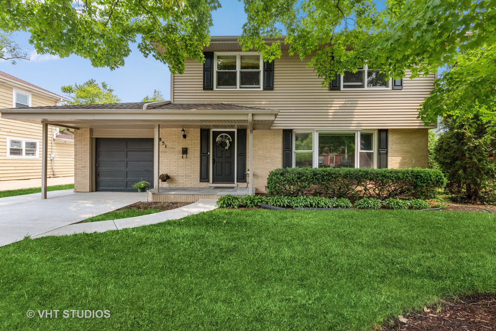 851 Warrington Road Deerfield, IL 60015 - Photo 1 of 25 a view of a house with a yard and plants