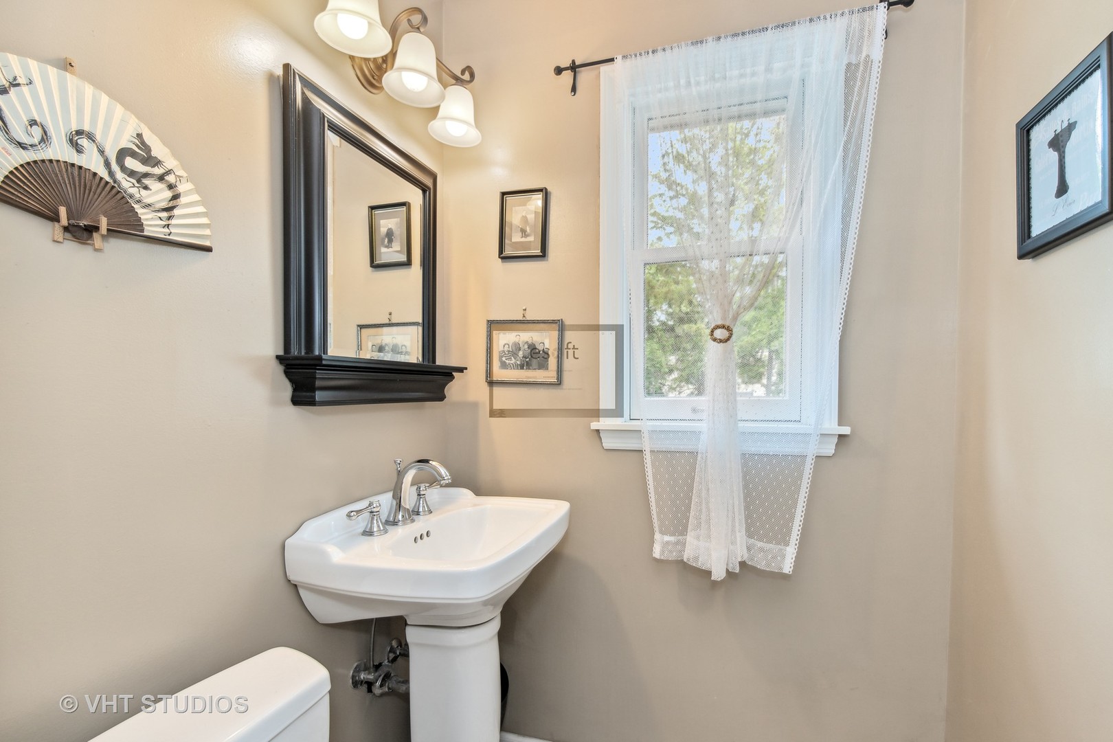 851 Warrington Road Deerfield, IL 60015 - Photo 13 of 25 a bathroom with a sink a mirror and a window