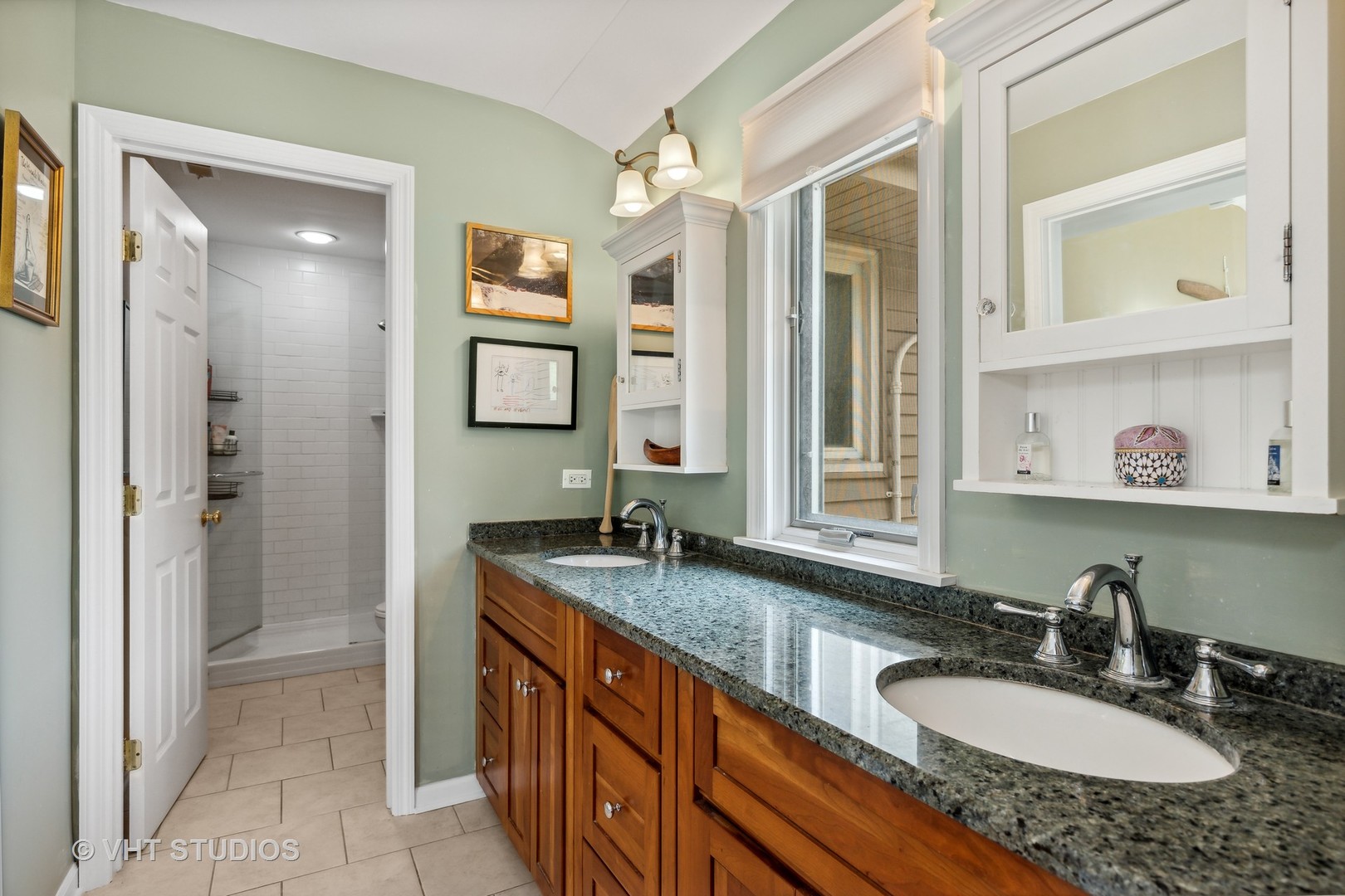 851 Warrington Road Deerfield, IL 60015 - Photo 16 of 25 a bathroom with a granite countertop double vanity sink a mirror and a