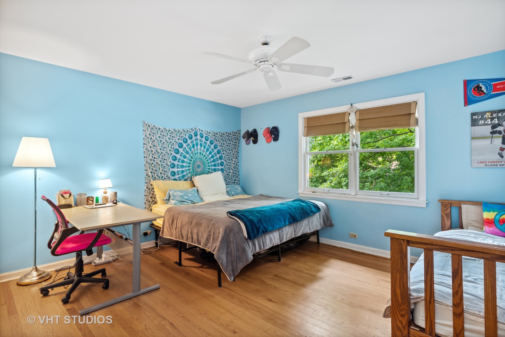 851 Warrington Road Deerfield, IL 60015 - Photo 17 of 25 a bedroom with a bed and a chandelier