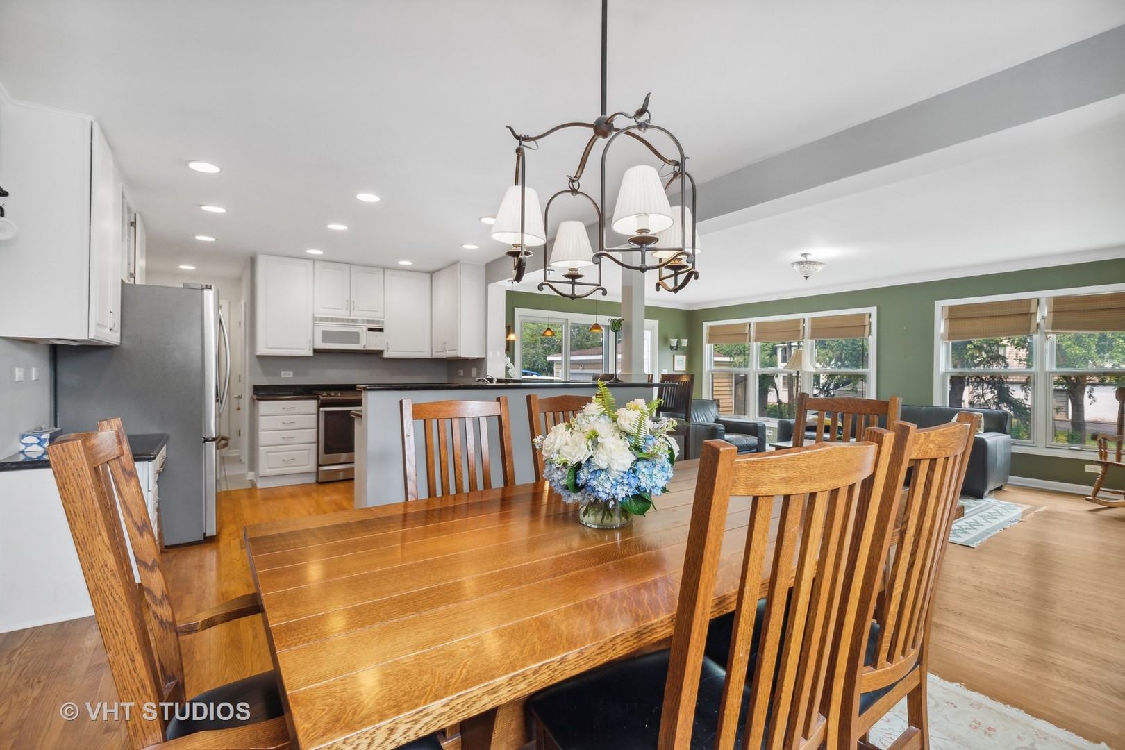 851 Warrington Road Deerfield, IL 60015 - Photo 5 of 25 a view of a dining room and livingroom with furniture wooden floor a chandelier