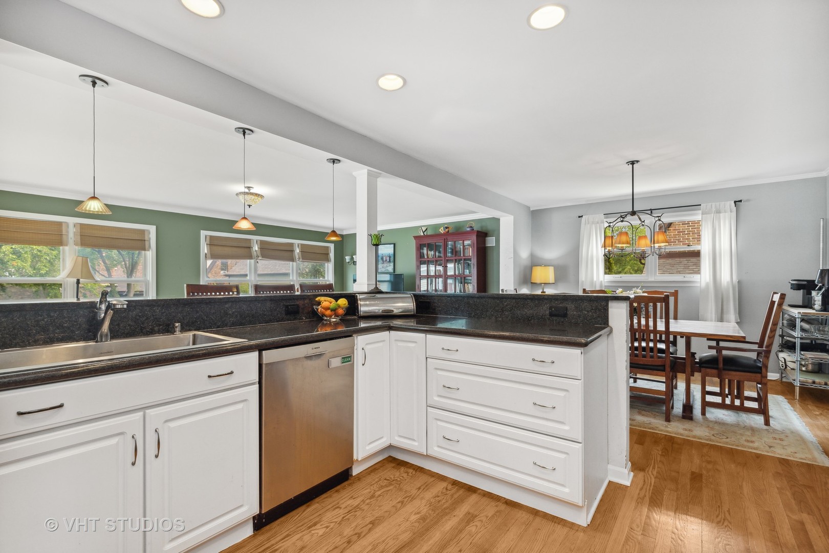 851 Warrington Road Deerfield, IL 60015 - Photo 9 of 25 a kitchen with granite countertop a sink cabinets and wooden floor