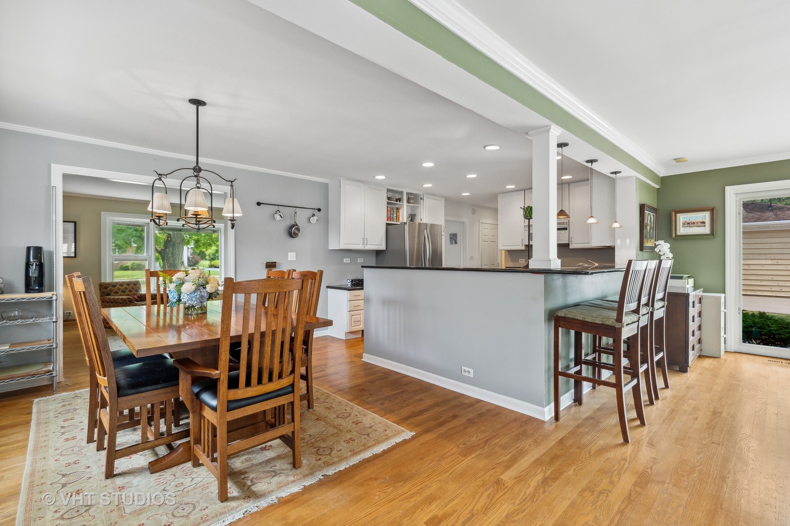 851 Warrington Road Deerfield, IL 60015 - Photo 10 of 25 a dining room with furniture a chandelier and wooden floor