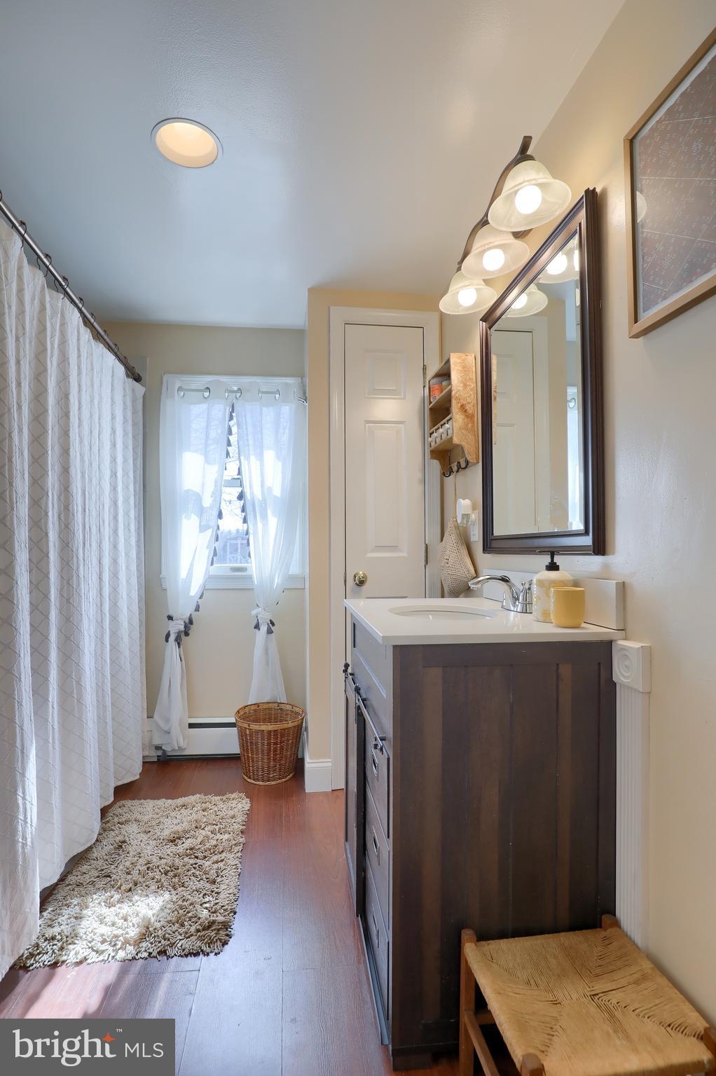 4851 Homeville Road Cochranville, PA 19330 - Photo 30 of 44 a bathroom with a sink vanity and a mirror