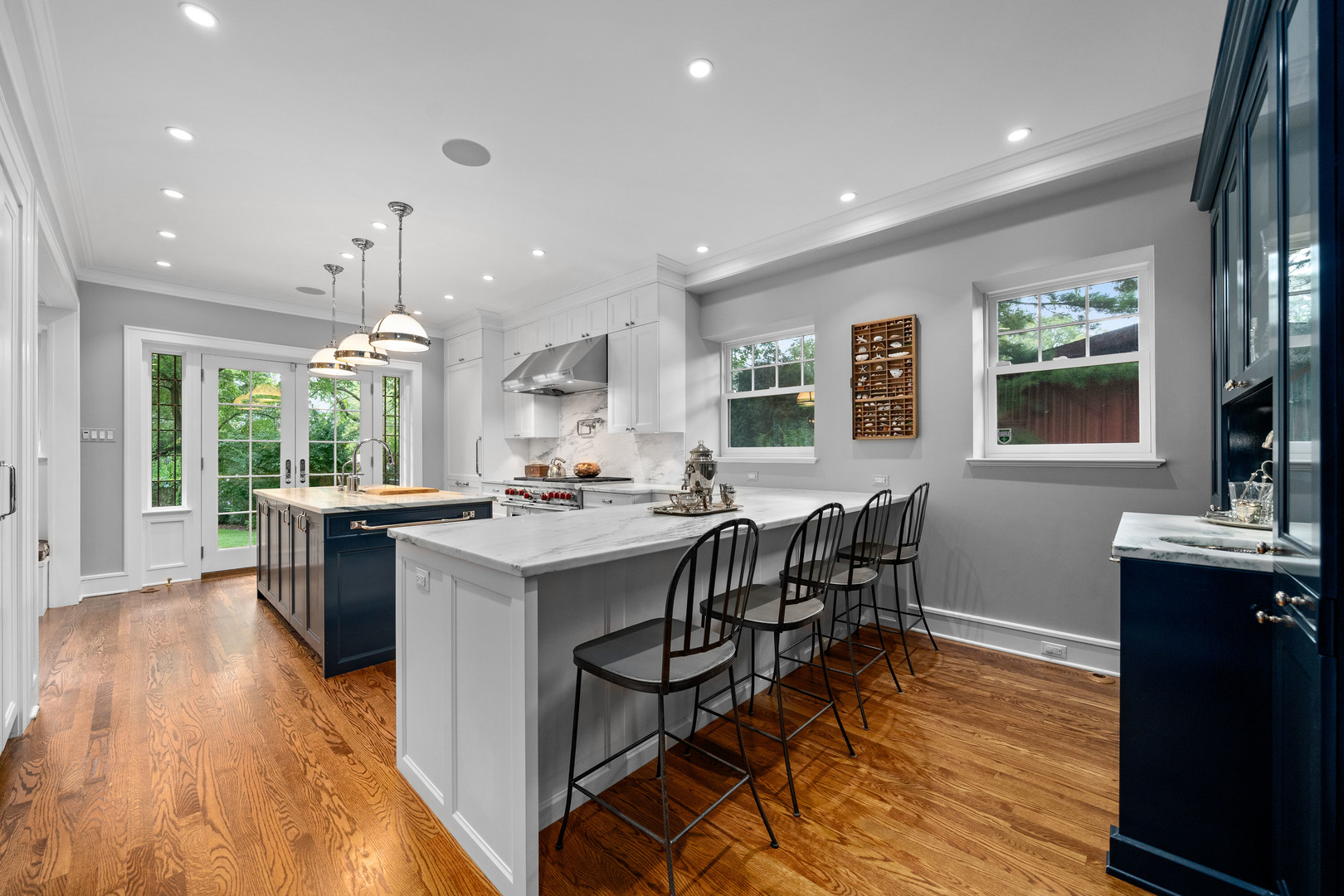 732 Sheridan Road Evanston, IL 60202 - Photo 12 of 46 a kitchen with stainless steel appliances granite countertop sink stove and wooden floor