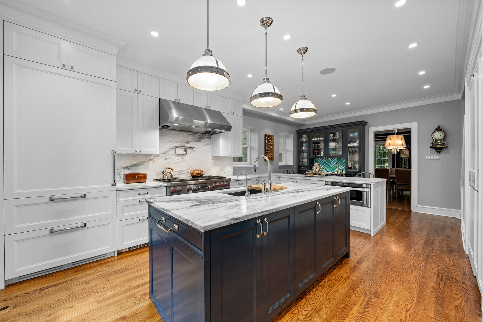 732 Sheridan Road Evanston, IL 60202 - Photo 15 of 46 a kitchen with a stove a sink a refrigerator and chairs