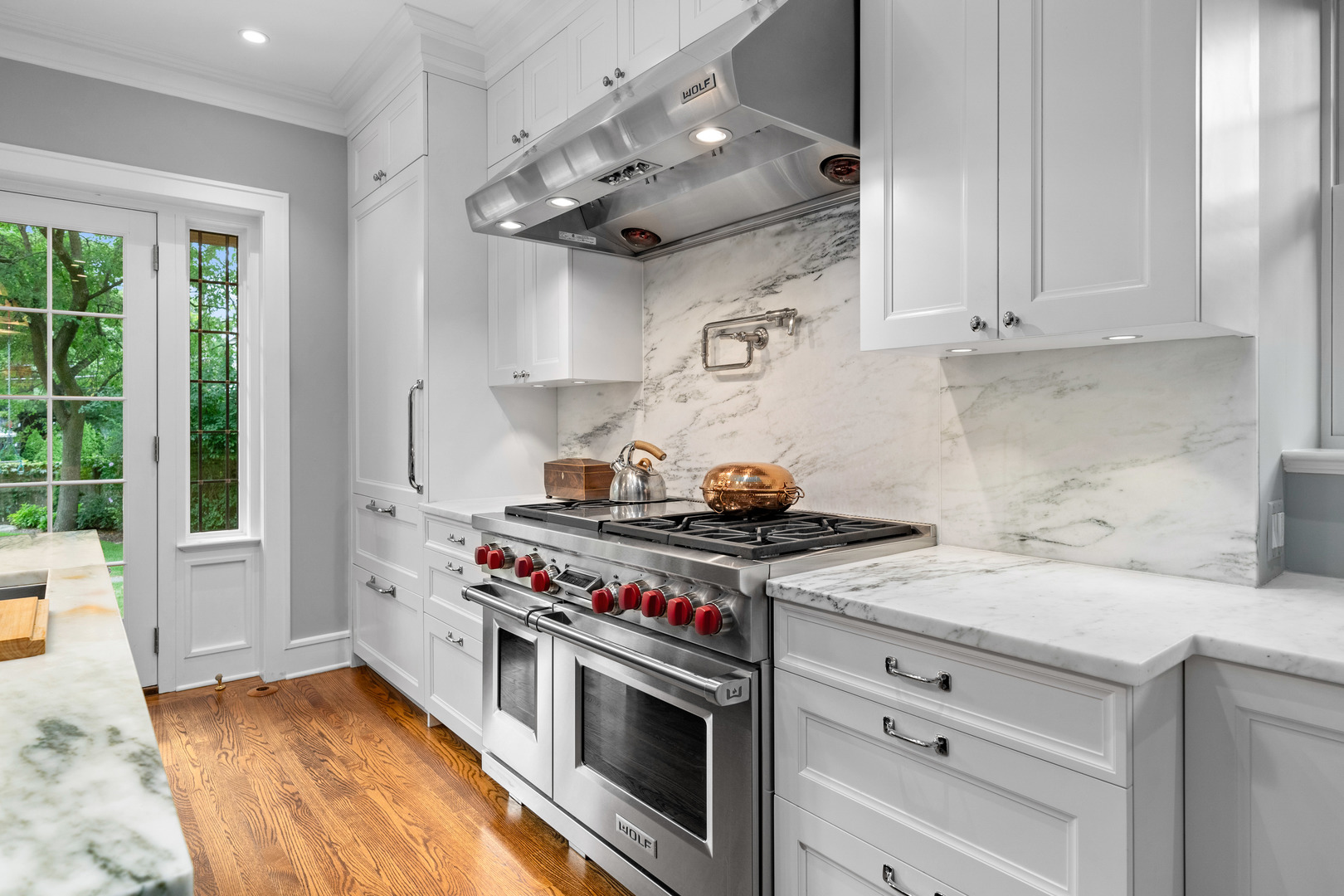 732 Sheridan Road Evanston, IL 60202 - Photo 16 of 46 a kitchen with stainless steel appliances a stove and white cabinets