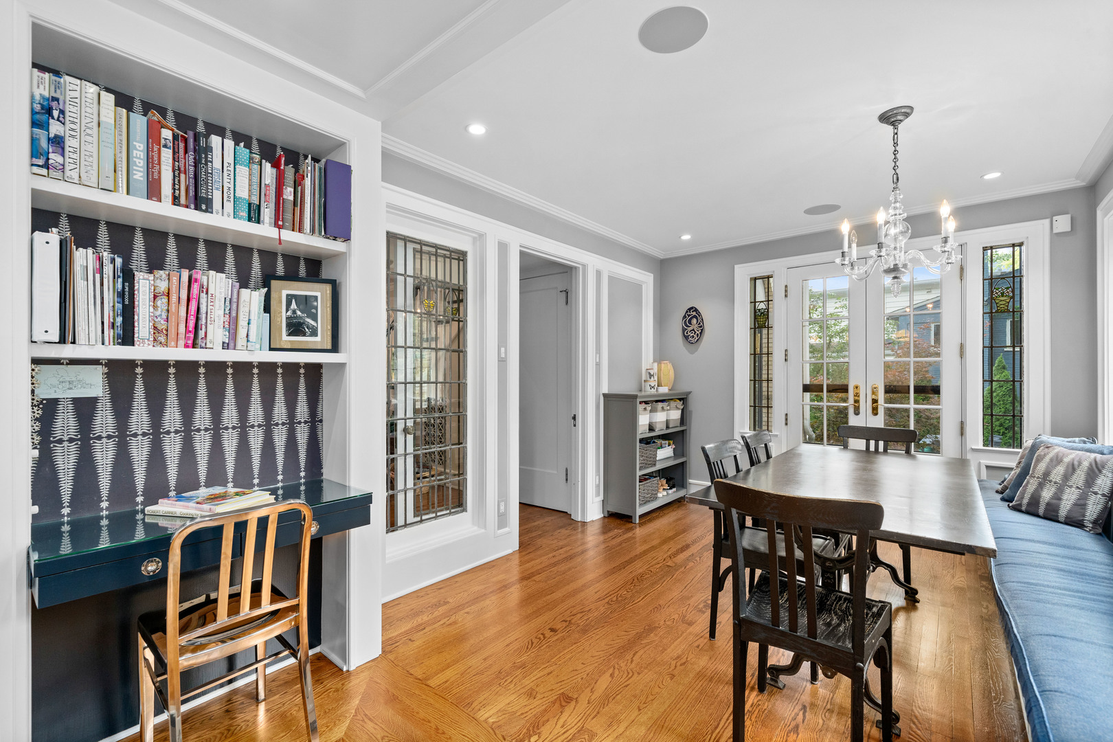 732 Sheridan Road Evanston, IL 60202 - Photo 18 of 46 a dining room with furniture a book shelves and wooden floor