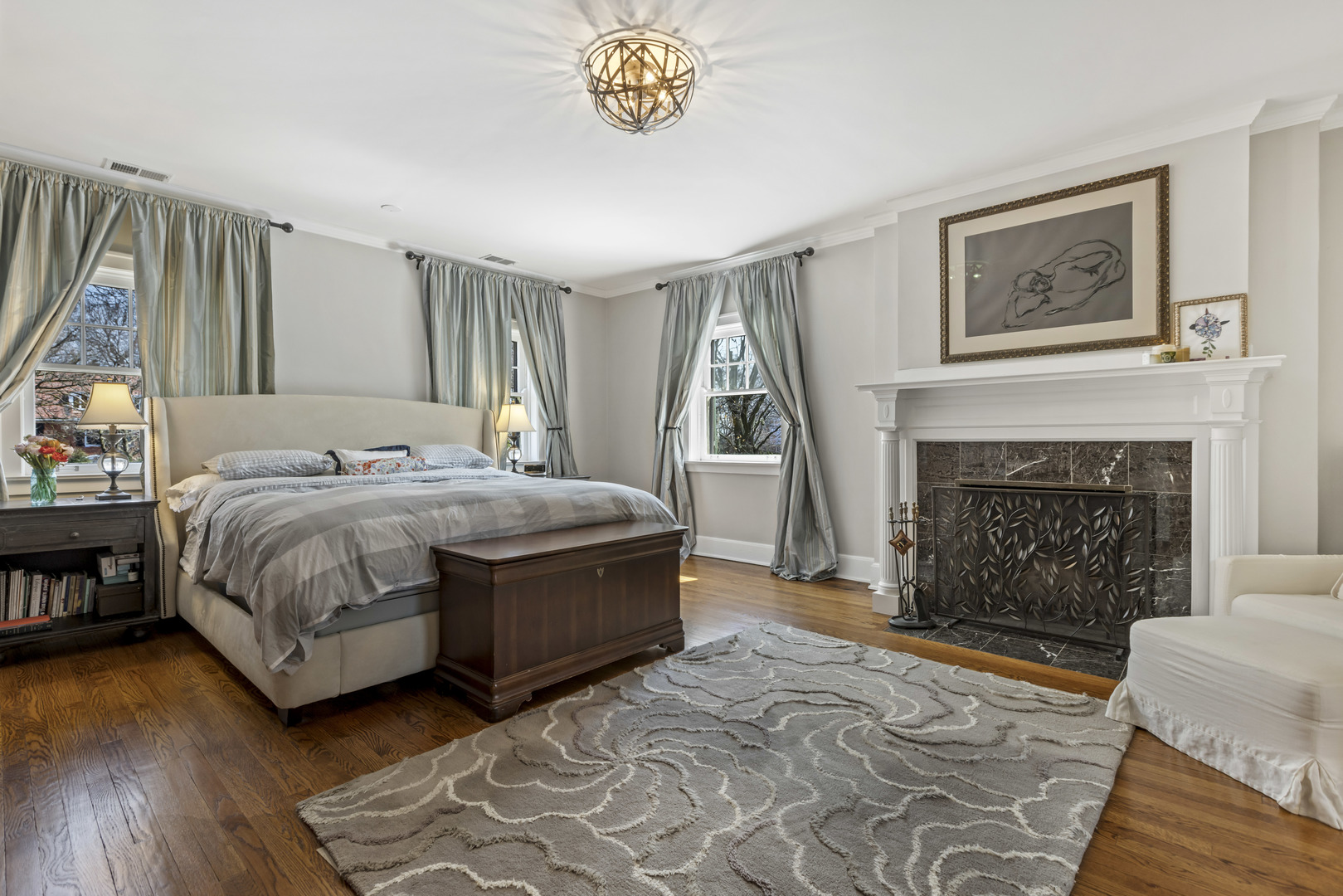 732 Sheridan Road Evanston, IL 60202 - Photo 23 of 46 a bedroom with a bed and a fireplace