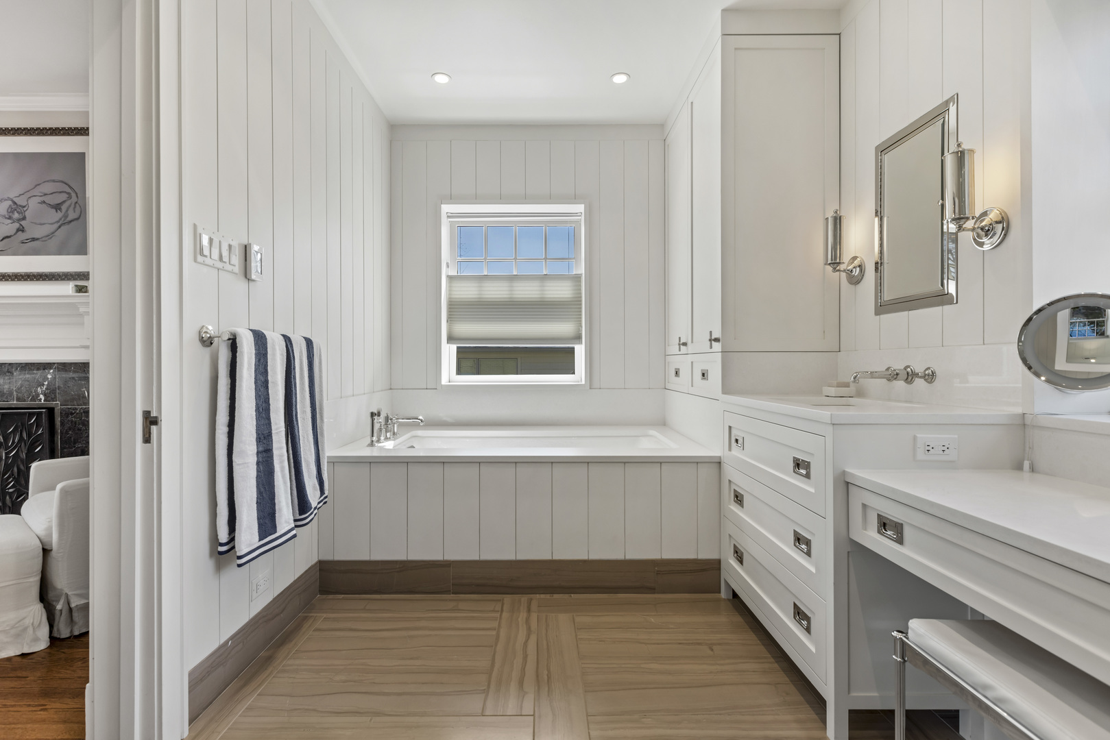 732 Sheridan Road Evanston, IL 60202 - Photo 25 of 46 a bathroom with a double vanity sink a mirror and a bathtub