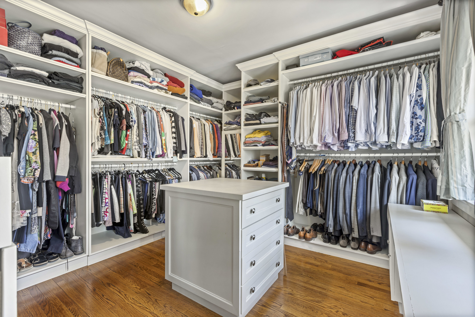 732 Sheridan Road Evanston, IL 60202 - Photo 27 of 46 a view of walk in closet with clothes and shoes