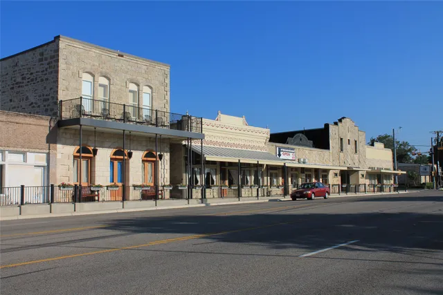 a view of an buildings with a street
