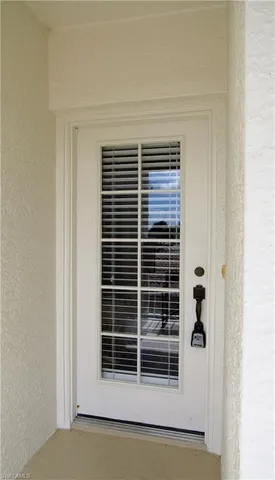 a view of wooden floor and a window