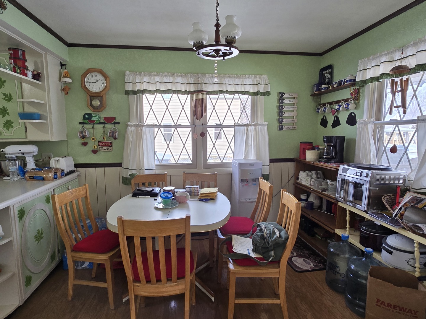 1408 South 10th Street Clinton, IA 52732 - Photo 2 of 10 a dining room with furniture a rug and a large window