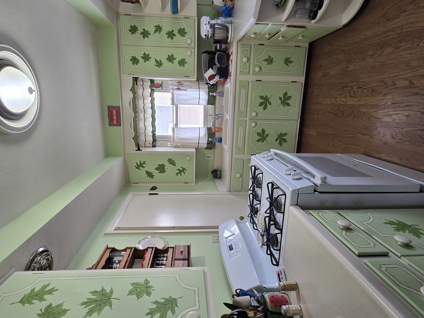 1408 South 10th Street Clinton, IA 52732 - Photo 3 of 10 a view of a bedroom with baby crib and furniture