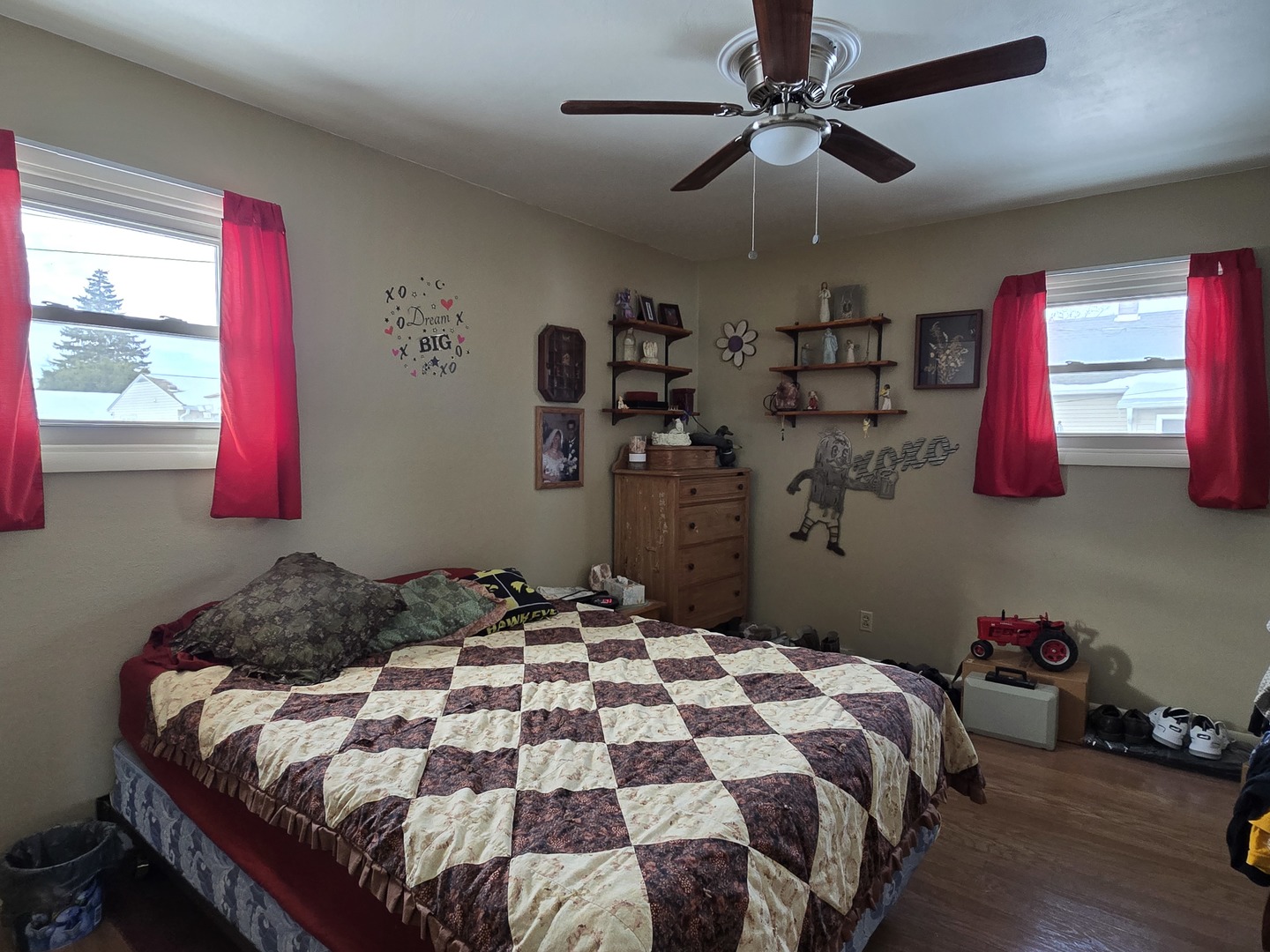 1408 South 10th Street Clinton, IA 52732 - Photo 9 of 10 a bedroom with a bed and a chandelier