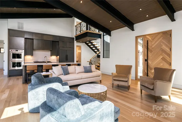 a living room with fireplace furniture and a flat screen tv