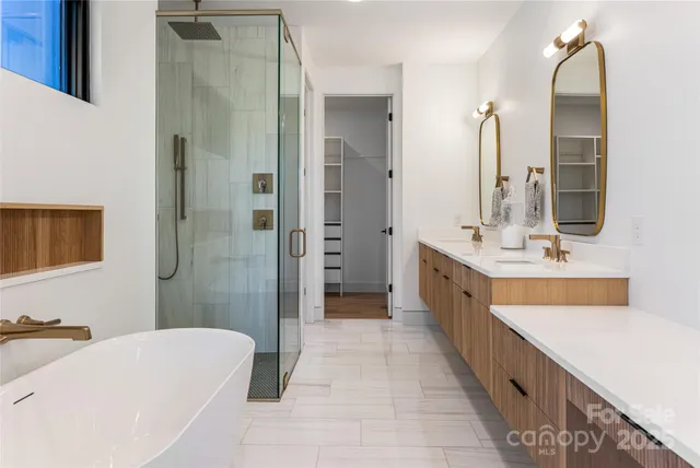 a bathroom with a bathtub and a shower