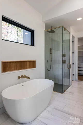 a bathroom with double vanity sinks and a mirror
