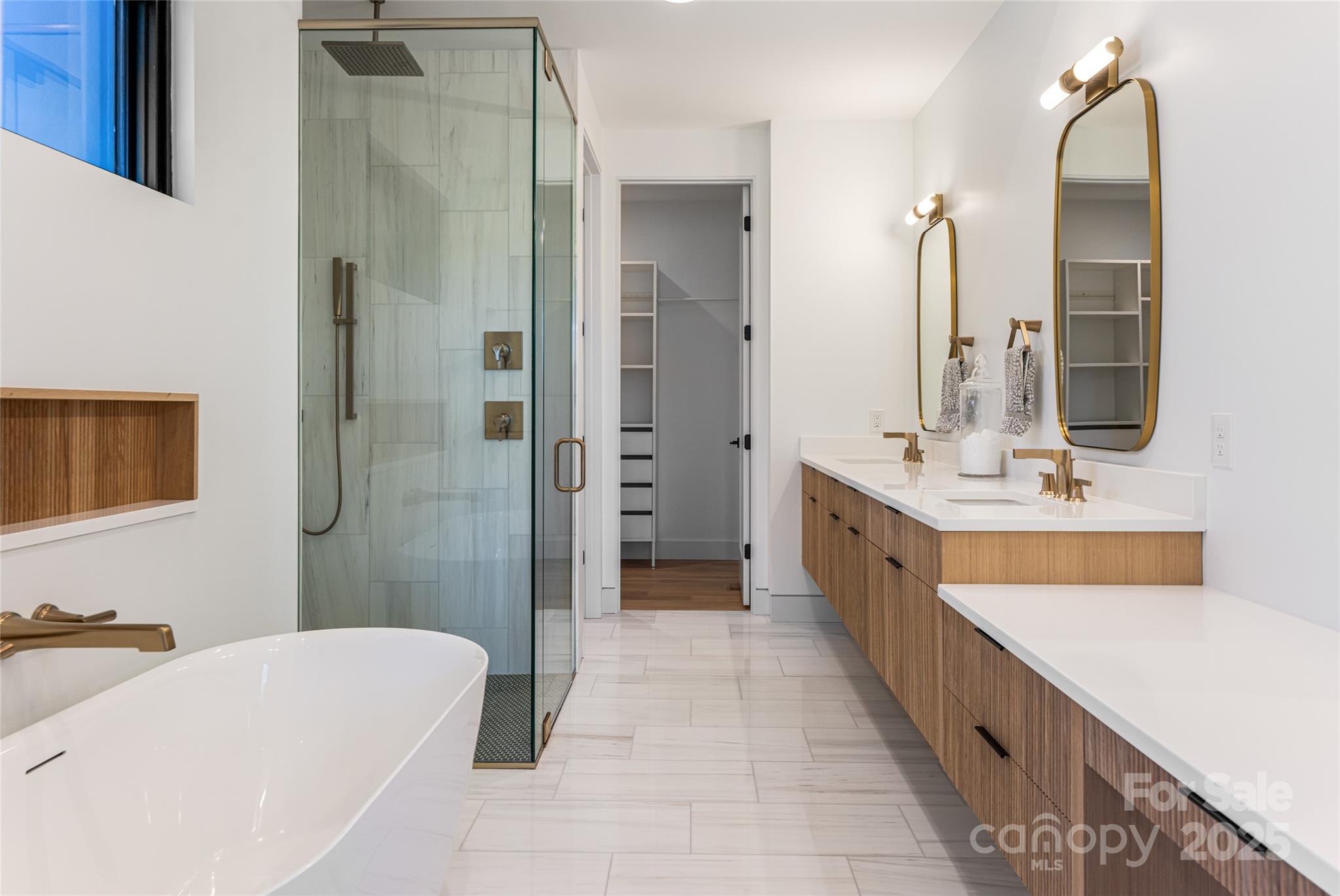 371 Oklahoma Road Montreat, NC 28711 - Photo 25 of 48 a bathroom with a double vanity sink a large mirror a shower and bathtub