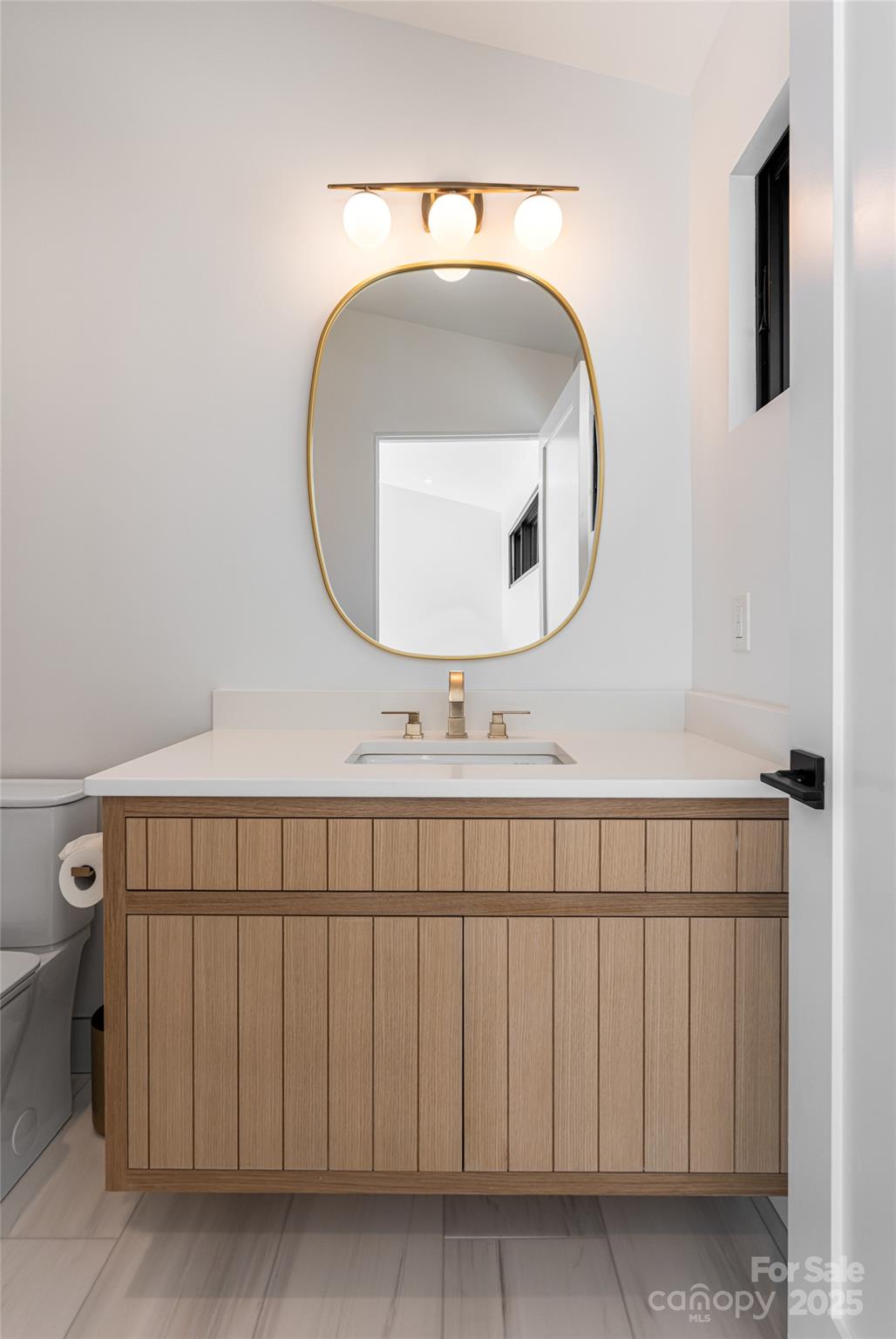 371 Oklahoma Road Montreat, NC 28711 - Photo 33 of 48 a bathroom with a sink and a mirror