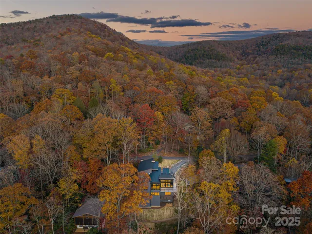 a view of a house with a mountain yard