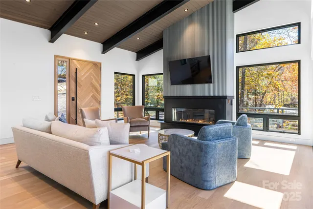 a living room with furniture fireplace and a flat screen tv