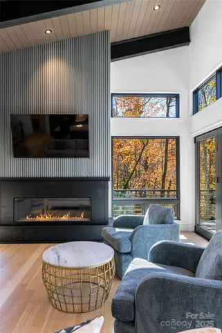 a kitchen with a stove and a wooden floor