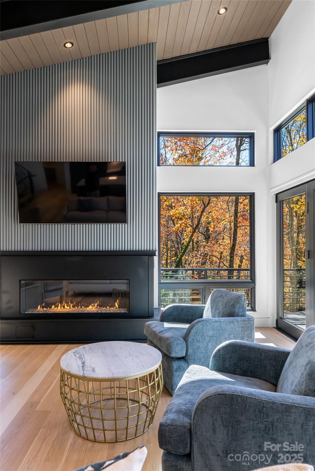 371 Oklahoma Road Montreat, NC 28711 - Photo 9 of 48 a living room with furniture and a flat screen tv