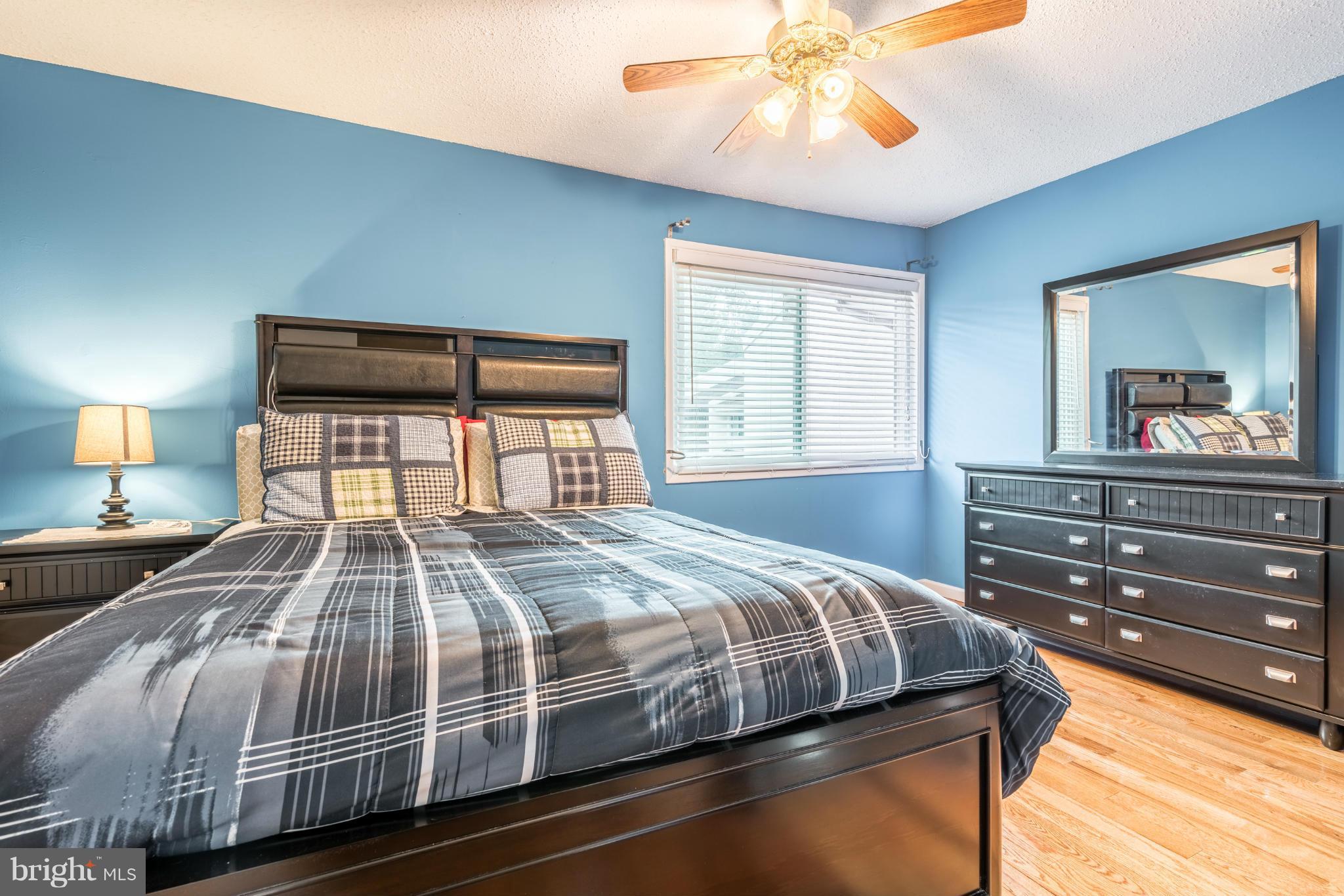 2402 Southgate Square Reston, VA 20191 - Photo 12 of 21 a bedroom with a bed and a chandelier