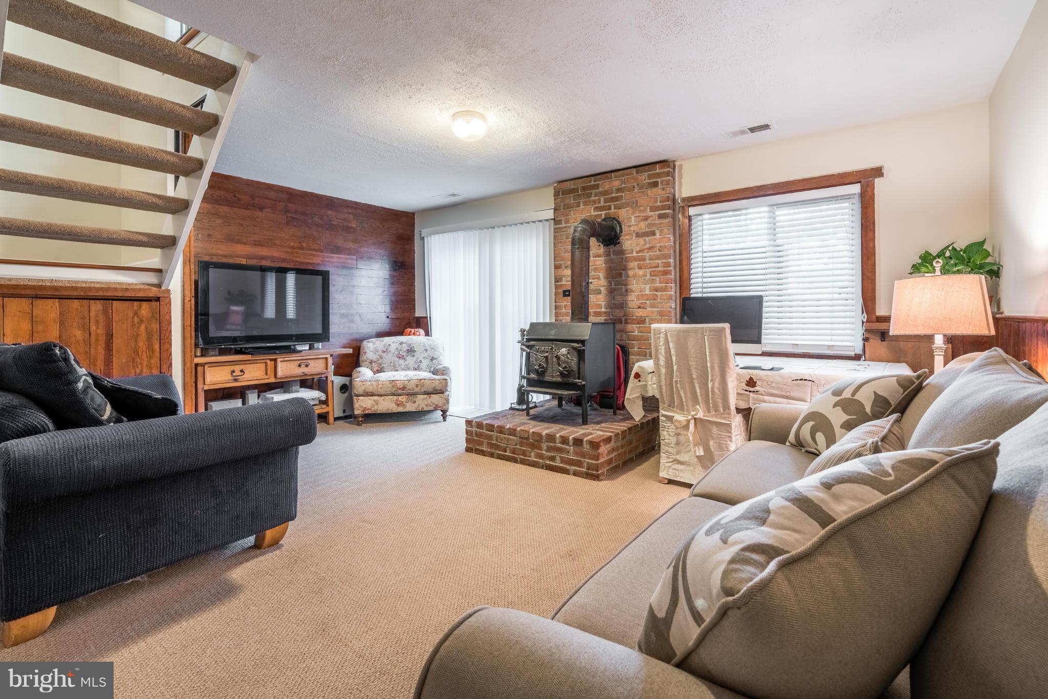 2402 Southgate Square Reston, VA 20191 - Photo 14 of 21 a living room with furniture and a fireplace