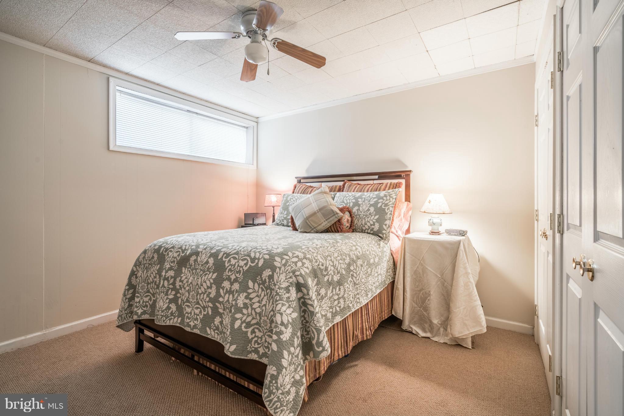 2402 Southgate Square Reston, VA 20191 - Photo 17 of 21 a bedroom with a bed and window