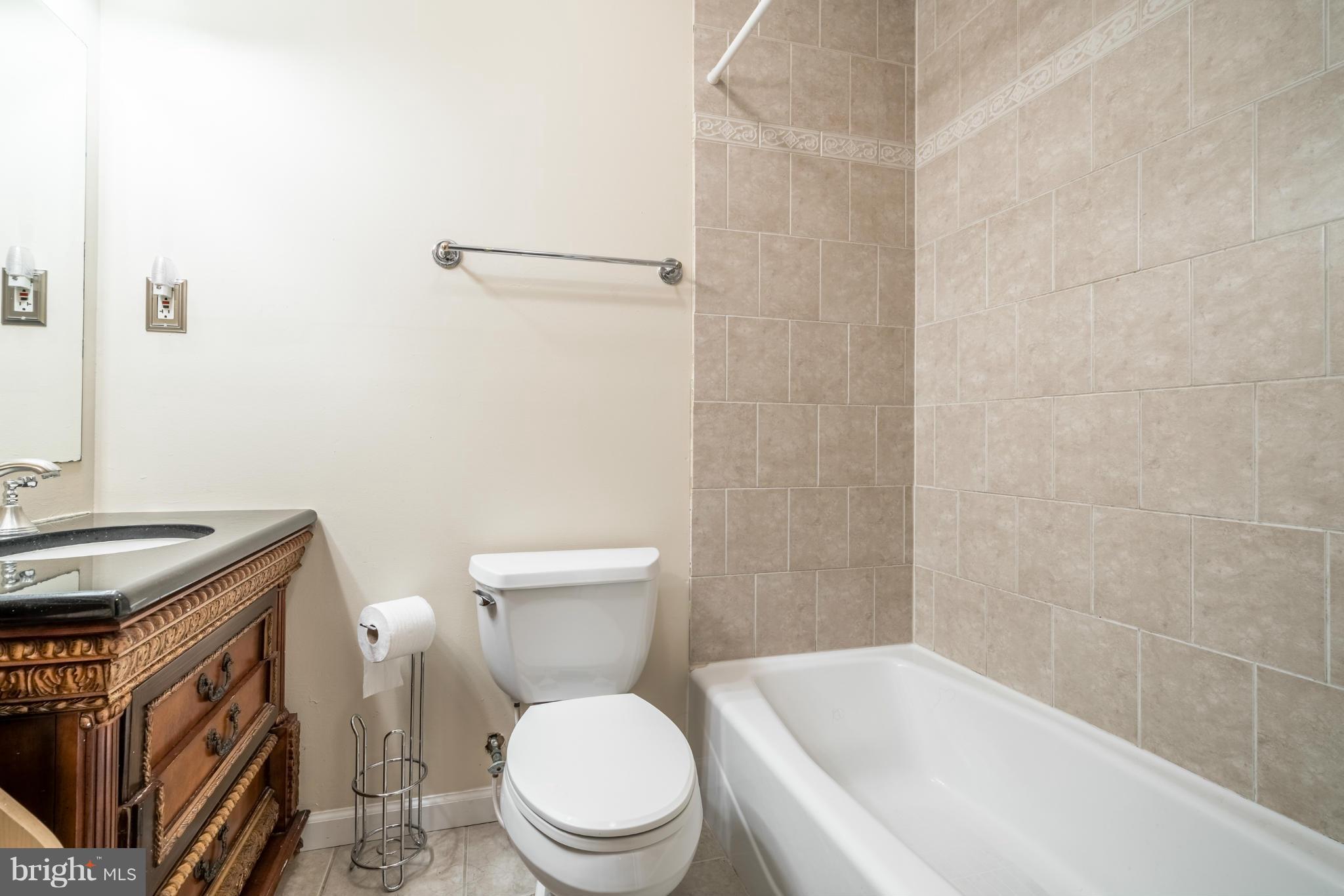 2402 Southgate Square Reston, VA 20191 - Photo 18 of 21 a white toilet sitting next to a bath tub